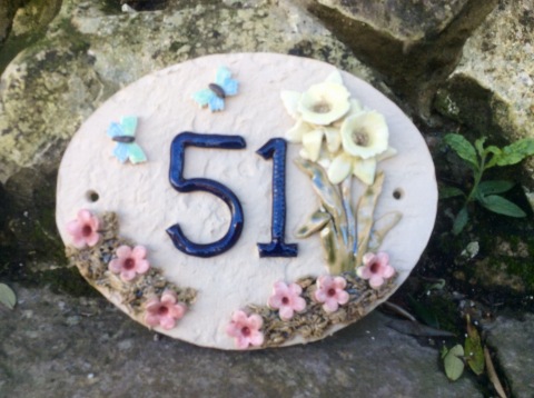 Oval  - daffodil and butterfly design.