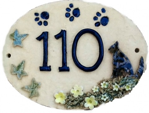 Cat design.  Oval shape, cat and paw prints